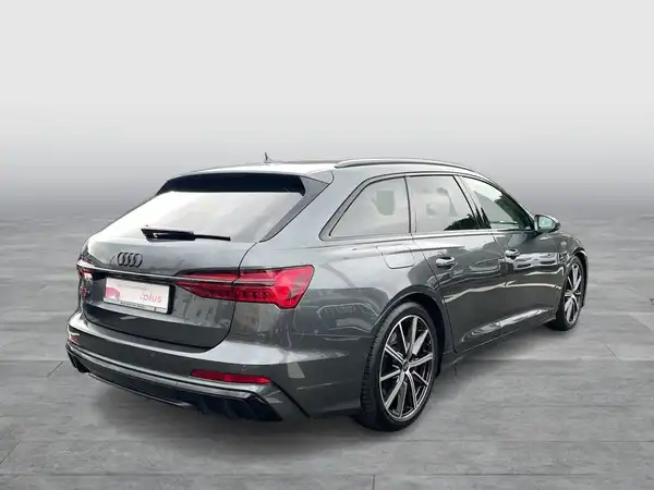 Das Bild zeigt einen AUDI S6 AVANT von hinten in grau.