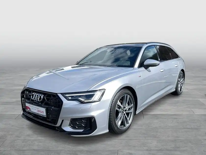 Das Bild zeigt einen silbernen Audi A6 Avant von der Seite. Es ist ein Fahrzeugbild und enthält das Händlerlogo 'Audi Zentrum Siegen' sowie zusätzliche Texteinblendungen.