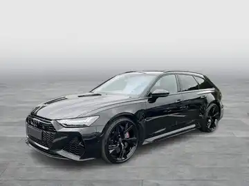 Das Bild zeigt einen schwarzen AUDI QUATTRO von der Seite.