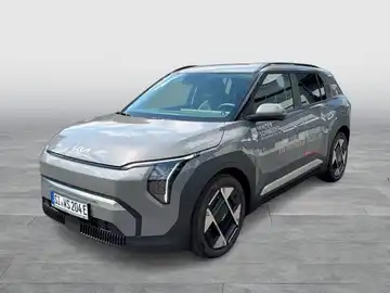 Das Bild zeigt ein graues KIA EV6 Fahrzeug, aufgenommen von der Seite. Es enthält markante Texteinblendungen.