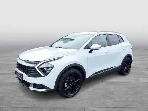 Es handelt sich um ein Bild eines weißen KIA Sportage, aufgenommen von der Seite.