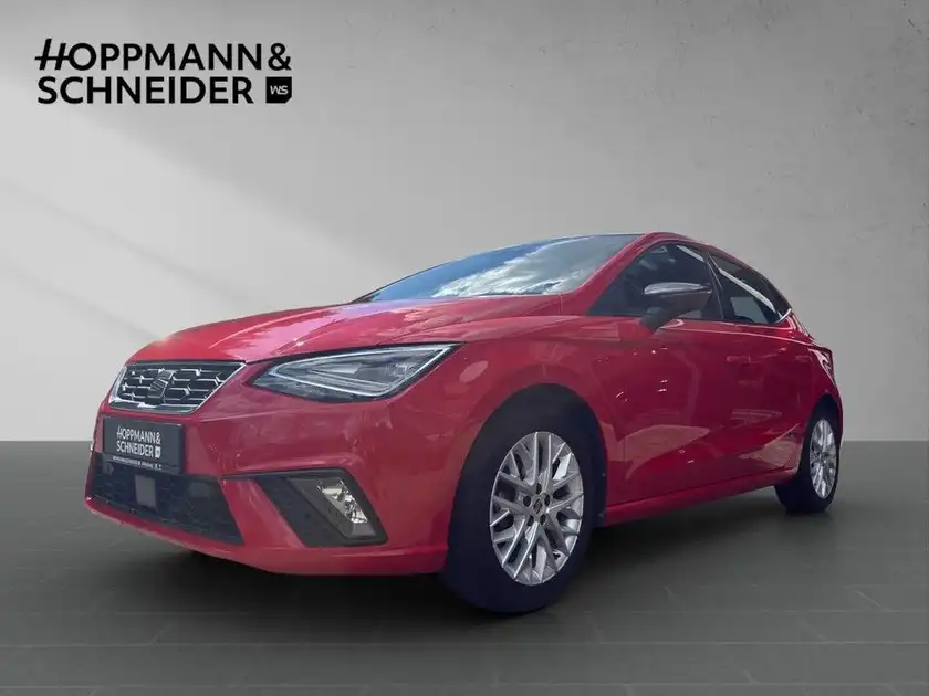 Das Bild zeigt ein rotes Fahrzeug (SEAT IBIZA) in einer seitlichen Ansicht. Im oberen Bereich ist das Händlerlogo "HOPPMANN & SCHNEIDER" eingeblendet.