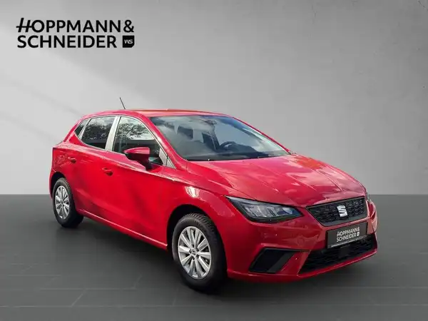 Das Bild zeigt einen roten SEAT IBIZA aus der Seitenansicht. Im oberen Bereich ist das Händlerlogo 'HOPPMANN & SCHNEIDER' eingeblendet.