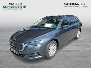 Das Bild zeigt einen blauen ŠKODA OCTAVIA von vorne. Es enthält das Händlerlogo 'WALTER SCHNEIDER' und einige markante Texteinblendungen.