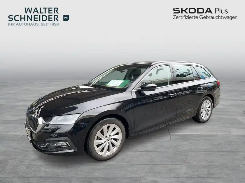 Das Bild zeigt einen schwarzen ŠKODA OCTAVIA von der Seite. Es ist ein Händlerlogo im Bild sichtbar.