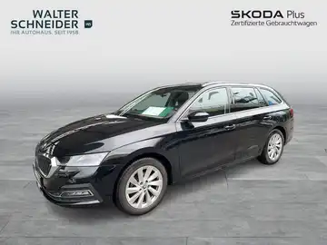 Das Bild zeigt einen schwarzen ŠKODA OCTAVIA von der Seite. Es ist ein Händlerlogo im Bild sichtbar.