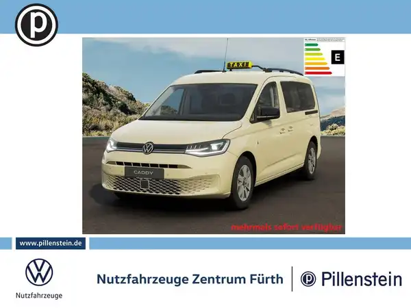 Das Bild zeigt einen VW Caddy von vorne in beige mit einem Händlerlogo sowie weiteren Texteinblendungen.