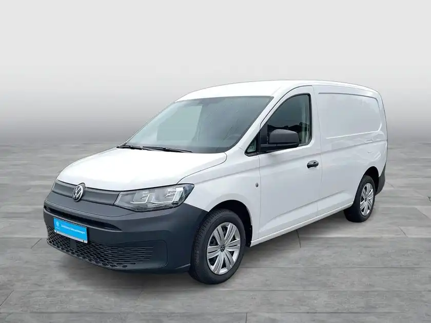 Seitenansicht eines weißen VW Caddy.