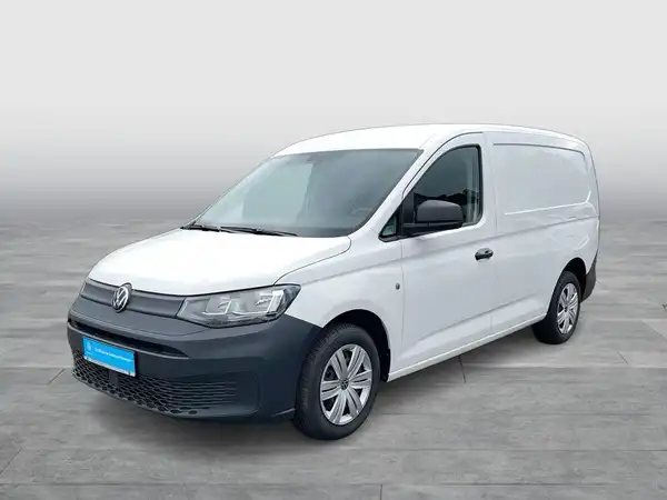 Seitenansicht eines weißen VW Caddy.