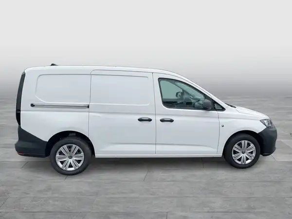 Das Bild zeigt einen weißen VW Caddy von der Seite.