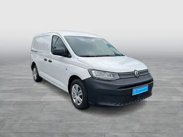 Das Bild zeigt einen weißen VW Caddy von der Seite.