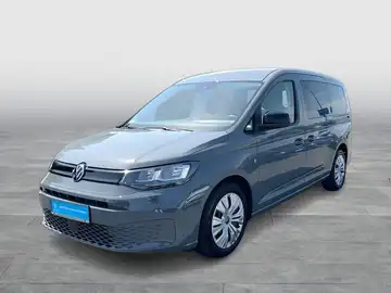 Das Bild zeigt einen grauen VW Caddy von vorne. Das Händlerinformationen sind im unteren Bereich des Bildes sichtbar.