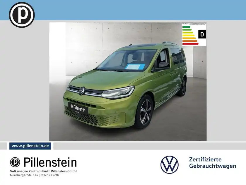 Das Bild zeigt einen grünen VW Caddy von vorne, präsentiert mit dem Logo des Händlers Pillenstein.