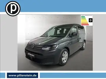 Das Bild zeigt einen grauen VW Caddy aus der Frontalansicht. Im Bild ist das Händlerlogo und eine Energieeffizienzklasse angezeigt.
