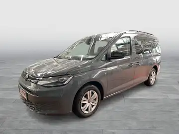 Ein grauer VW Caddy, seitlich aufgenommen, mit Sicht auf das Händlerlogo von Walter Schneider.