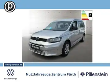 Das Bild zeigt einen silbernen VW Caddy von der Seite. Es enthält das Händlerlogo und markante Texteinblendungen.
