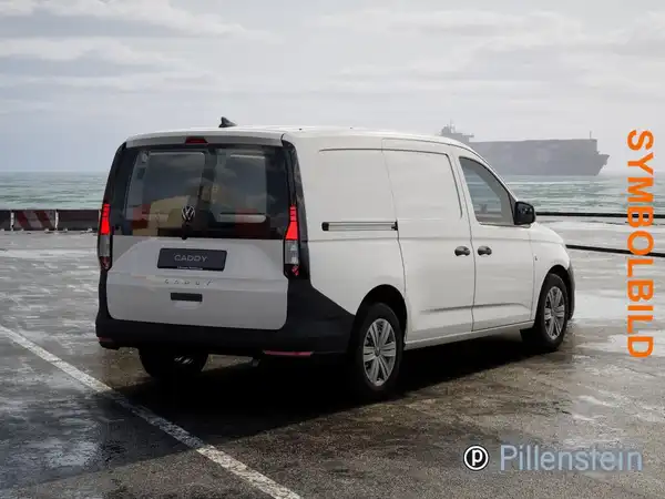Das Bild zeigt einen weißen VW Caddy von hinten, mit einem Händlerlogo und der Aufschrift 'SYMBOLBILD'.