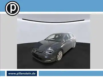 Das Bild zeigt einen grauen VW Golf aus der Frontansicht. Das Händlersymbol ist eingeblendet.