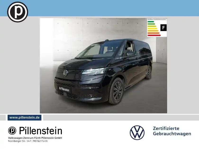 Das Bild zeigt einen schwarzen VW Multivan von der Seite. Es ist ein Fahrzeugbild mit Händlerlogo und Textmarkierung.