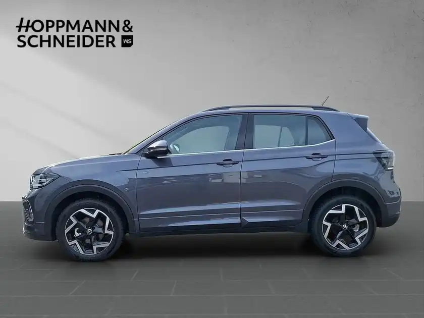 Das Bild zeigt einen grauen VW T-CROSS auf der Seite. Oben links ist das Händlerlogo von HOPPMANN & SCHNEIDER zu sehen.