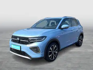 Das Bild zeigt einen VW T-Cross von der Seite in blauer Farbe. Es enthält kein Händlerlogo oder markante Texteinblendungen.