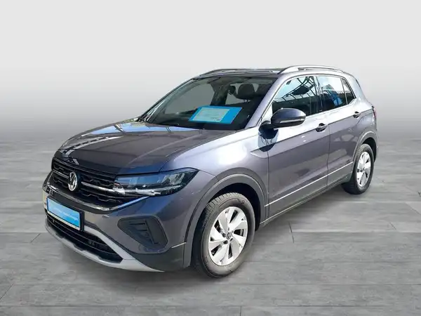 Das Bild zeigt einen grauen VW T-CROSS von der Seite, mit markanten Texteinblendungen und ohne Händlerlogo.