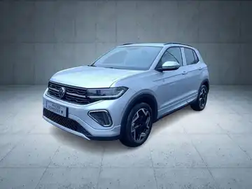 Das Bild zeigt einen VW T-CROSS aus der Seitenansicht in blauer Farbe auf einem neutralen Hintergrund.
