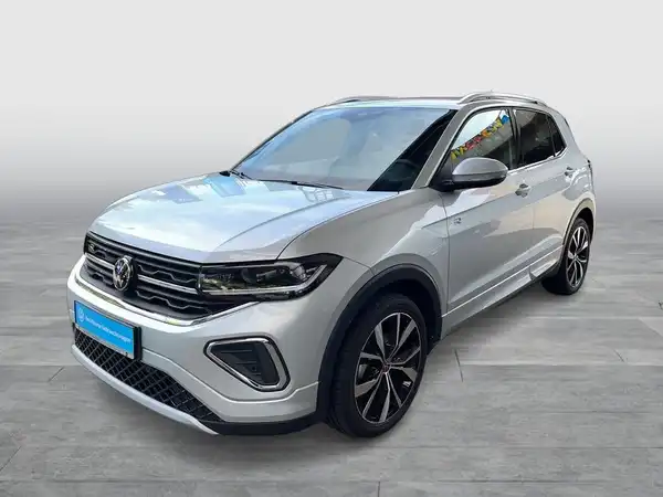 Das Bild zeigt einen silbernen VW T-Cross von der Seite.