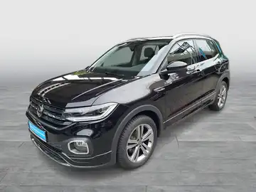 Das Bild zeigt einen VW T-CROSS in schwarzer Farbe von der Seite.