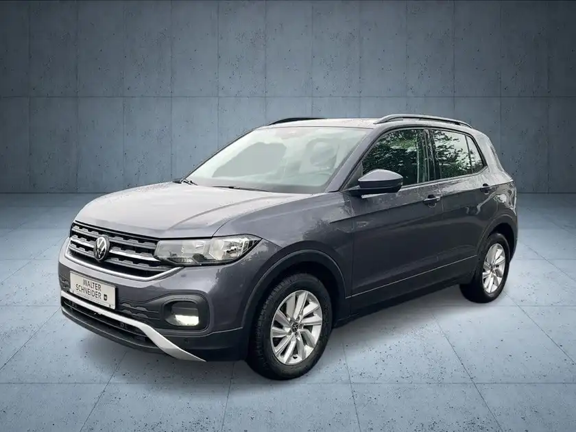 Das Bild zeigt einen VW T-CROSS von der Seite in grauer Farbe.