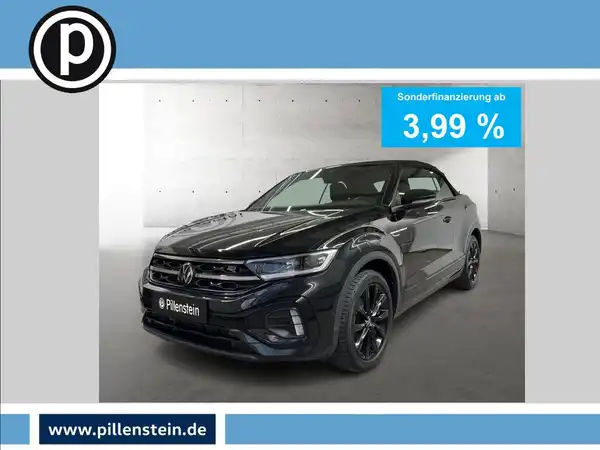 Das Bild zeigt einen schwarzen VW T-ROC CABRIOLET von der Seite. Im Hintergrund ist eine lightgraue Wand zu sehen. Oben rechts ist ein Text zu sehen, der Sonderfinanzierung ab 3,99 % bewirbt. Das Händlerlogo ist ebenfalls sichtbar.
