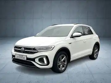 Das Bild zeigt ein weißes Fahrzeug (VW T-ROC) aus der Frontalansicht. Das Händlersymbol von Walter Schneider ist in der unteren Bildhälfte eingeblendet.
