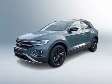 Das Bild zeigt einen grauen VW T-ROC von der Seite, mit dem Händlerinlogo von Walter Schneider und dem Hinweis auf zertifizierte Gebrauchtwagen.