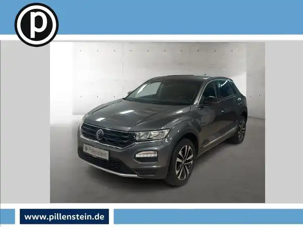 Das Bild zeigt einen VW T-ROC von der Seite in grauer Farbe. Das Händlerlogo ist eingeblendet.