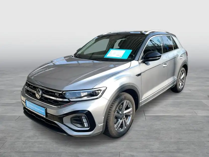 Das Bild zeigt einen silbernen VW T-ROC von vorne, mit einem Händlerlogo von Walter Schneider und einer Texteinblendung.