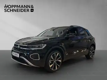 Das Bild zeigt einen schwarzen VW T-Roc aus der Seitenansicht, mit dem Händlerlogo HOPPMANN & SCHNEIDER im oberen Bereich.