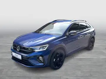 Das Bild zeigt einen VW TAIGO R-Line in blauer Farbe, aufgenommen von der Seite.