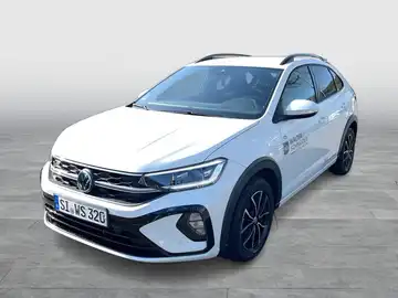 Das Bild zeigt einen weißen VW TAIGO R-Line aus der Frontansicht, mit dem Händlerlogo von Walter Schneider.