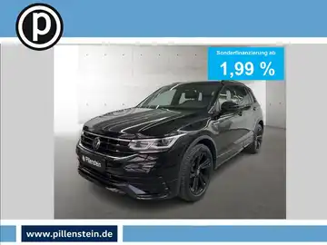 Das Bild zeigt einen schwarzen VW Tiguan aus der Frontalansicht. Es enthält eine markante Texteinblendung für Sonderfinanzierung und das Händlerlogo.